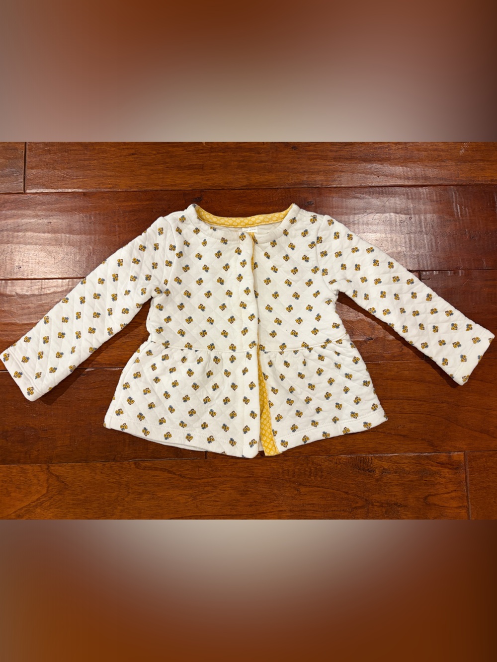 Quilted White Jacket with Yellow Floral Print and snap closures